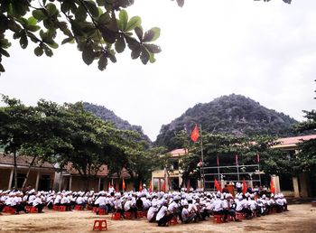 People in market against clear sky