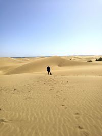 Mid distance view of man standing at dessert