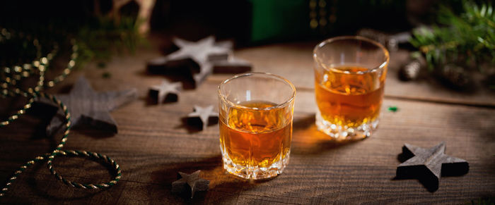 Whiskey, brandy or liquor shot and christmas decorations