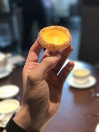 Close-up of hand holding ice cream