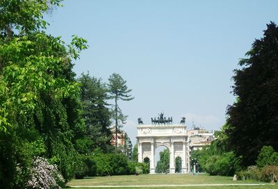 View of monument and trees against clear sky