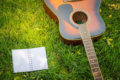 High angle view of guitar on field