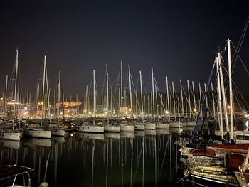 Boats moored at harbor