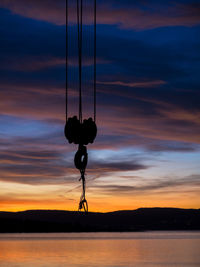 Silhouette of lake against sky during sunset