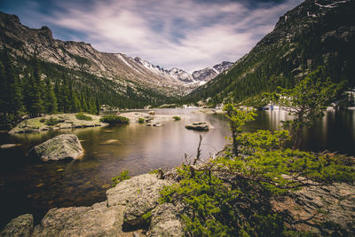 Scenic view of lake and mountains against sky