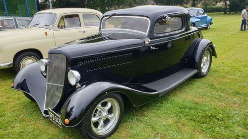 Vintage car parked on field