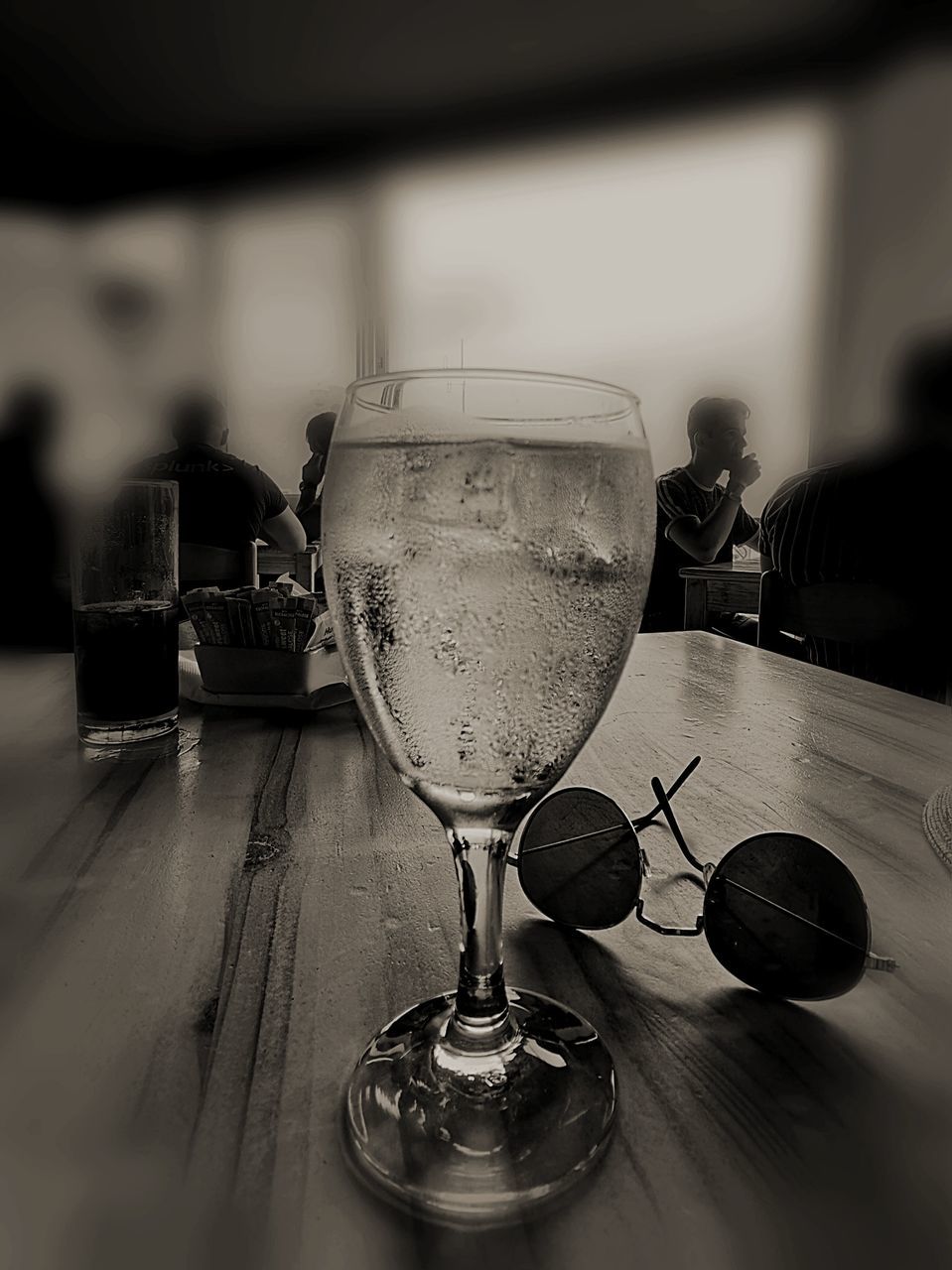 table, glass, drink, refreshment, glass - material, transparent, food and drink, alcohol, wineglass, close-up, wine, household equipment, still life, drinking glass, indoors, focus on foreground, freshness, no people, reflection, restaurant