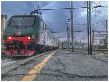 Train on railroad track against sky