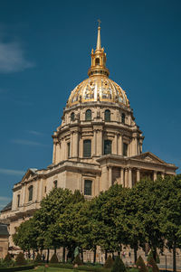 Front facade of les invalides palace with the golden dome in paris. the famous capital of france.