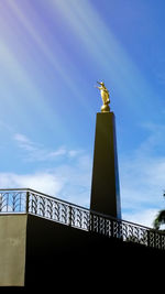 Low angle view of statue against sky
