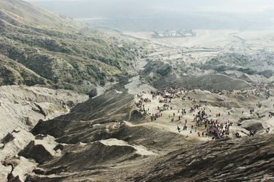 High angle view of people on mountain against sky