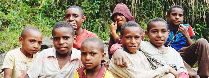 High angle view of two boys and group of people