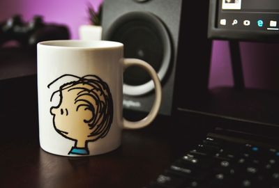 Close-up of coffee cup on table