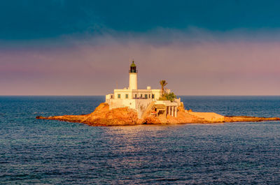 Arzew lighthouse by sea against nice sky