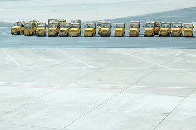 High angle view of vehicles on airport runway