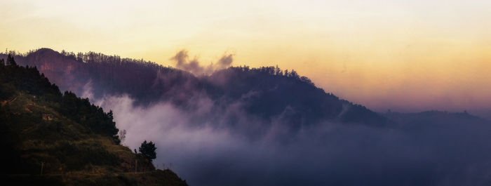 Scenic view of mountains against sky during sunset