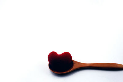 Close-up of heart shape over white background