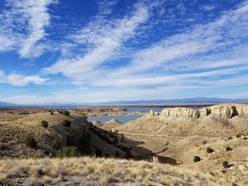 Panoramic view of landscape against blue sky