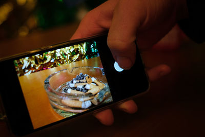 Close-up of person holding mobile phone