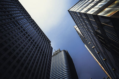 Low angle view of modern buildings against sky