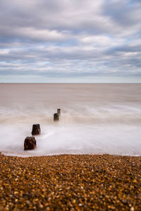 Scenic view of beach against sky