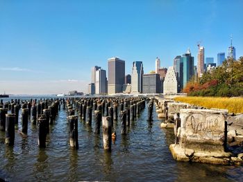 Panoramic view of sea and buildings against sky