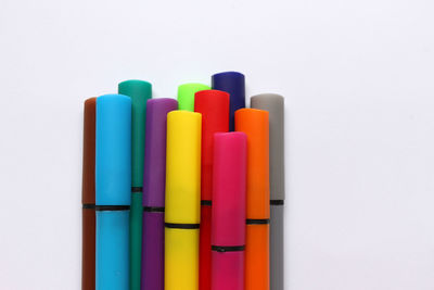 Close-up of colored pencils against white background