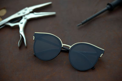 Close-up of sunglasses on table