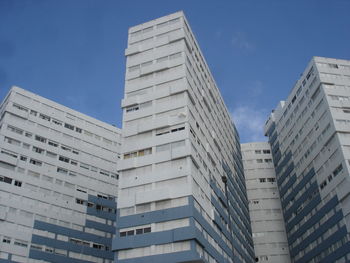 Low angle view of modern buildings against sky