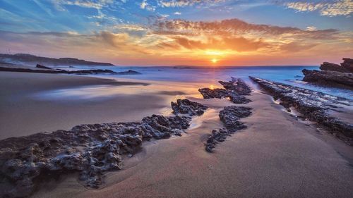Scenic view of sea at sunset