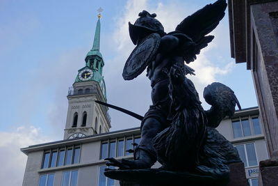 Low angle view of statue against sky