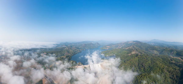 Beautiful panoramic landscape aerial view mae suai dam or reservoir and fog with blue sky background 