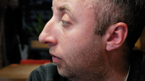 Close-up of young man looking away