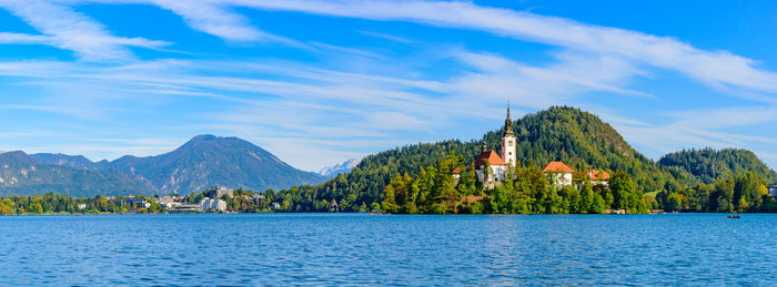 Panoramic view of building and mountains against sky