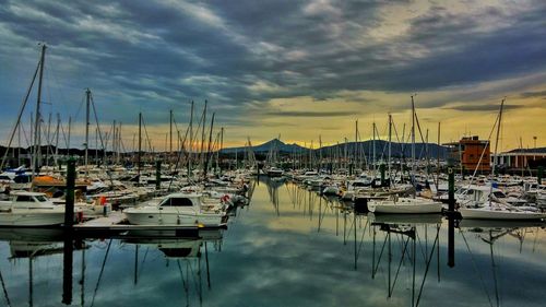 Boats moored at harbor