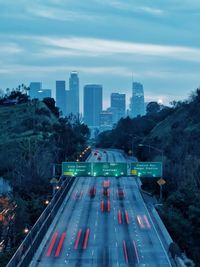 High angle view of highway amidst buildings in city