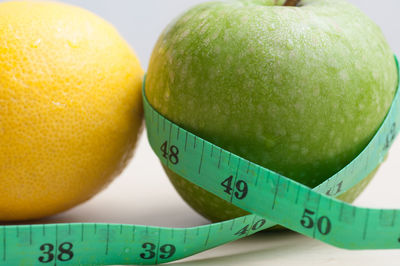 Close-up of oranges against white background