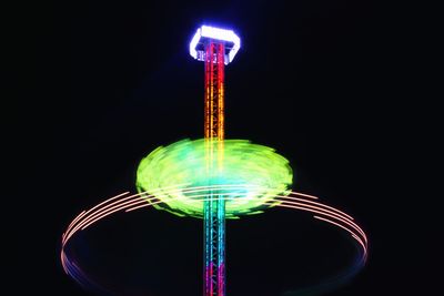 Low angle view of illuminated ferris wheel