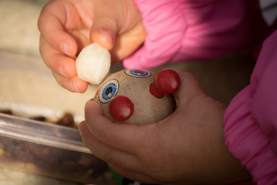 Close-up of baby girl playing with fruits