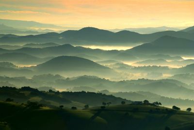 Scenic view of mountains against sky during sunset