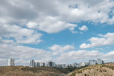 View of buildings against cloudy sky in ankara