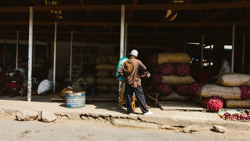 Rear view of man working at construction site