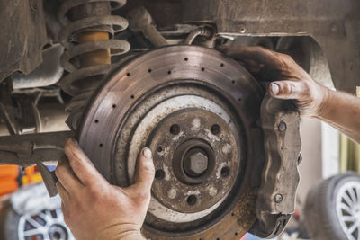 Cropped hand of man working at workshop