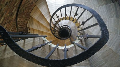 Directly below shot of spiral staircase in building