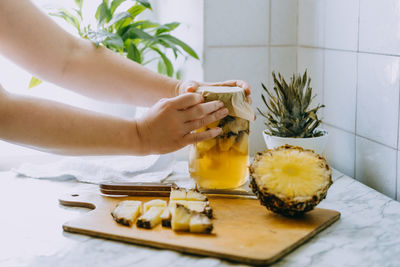 Fermented pineapple kombucha drink tepache. cooking process of homemade probiotic 