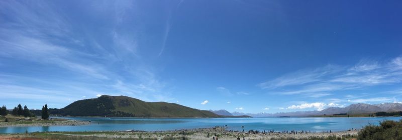 Panoramic view of sea against blue sky