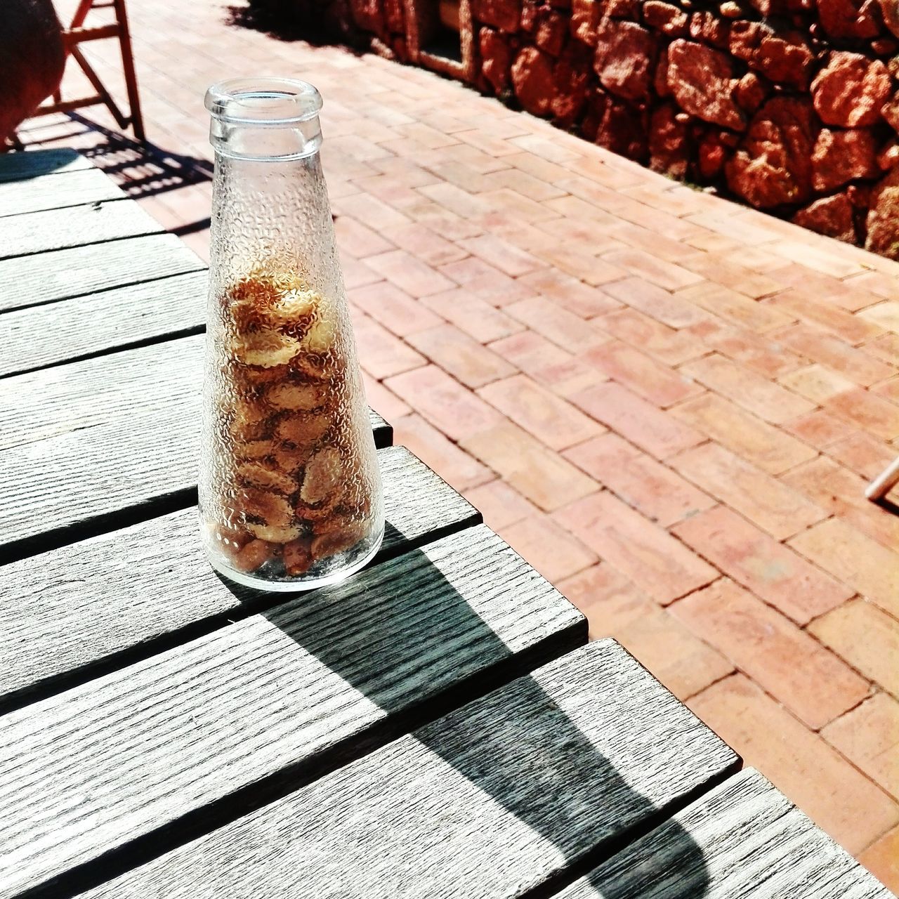 table, food and drink, wood - material, outdoors, drink, day, sunlight, no people, refreshment, close-up, freshness, food