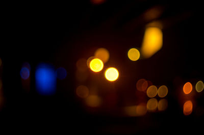Defocused image of illuminated lights at night