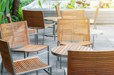 High angle view of empty chairs and table in restaurant