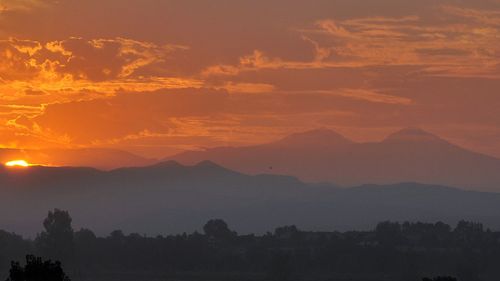 Scenic view of mountains at sunset